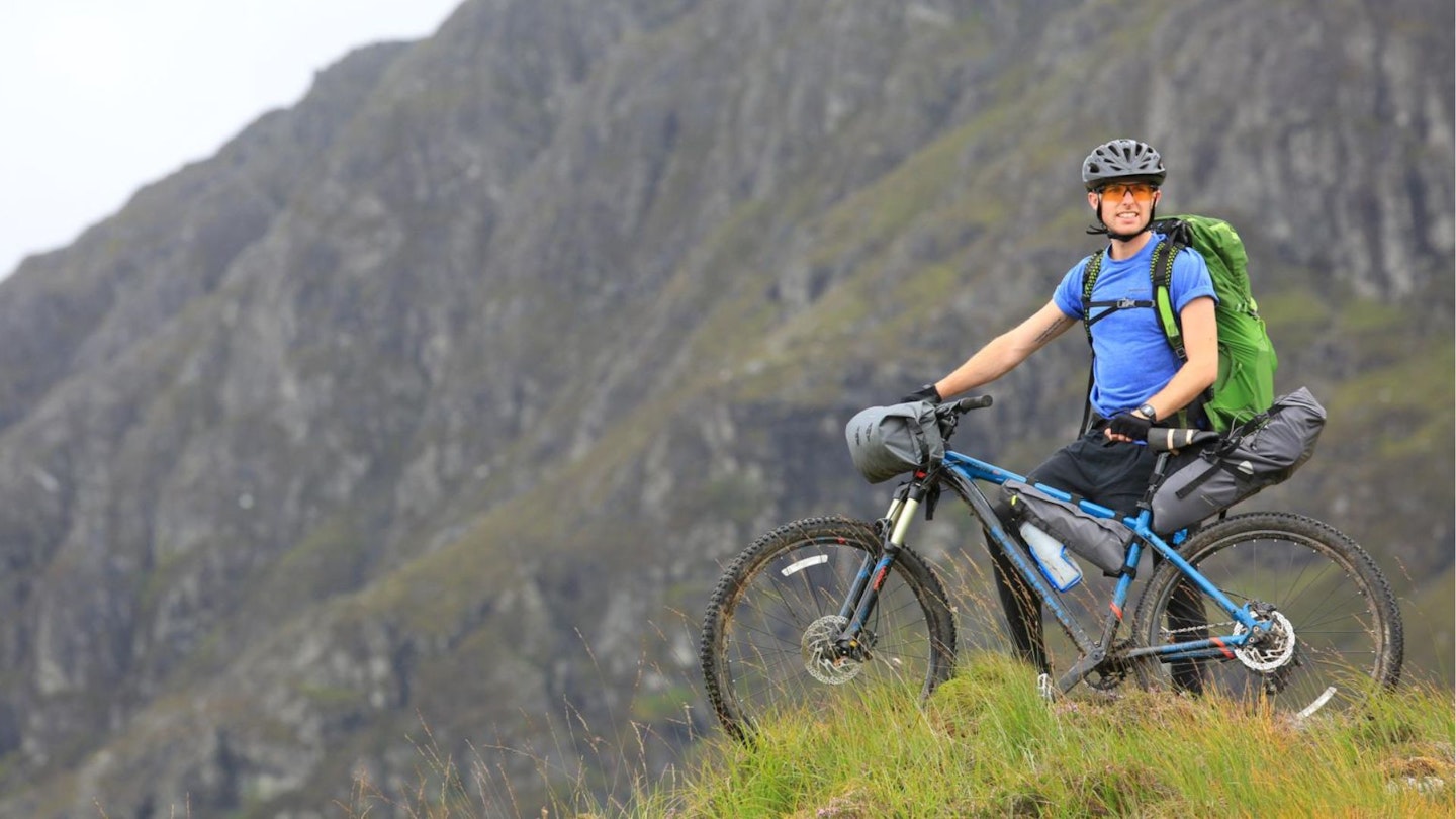Jake Kendall-Ashton on a single track track From Poolewe to Carnmore Fisherfield Forest Bikepacking Scotland