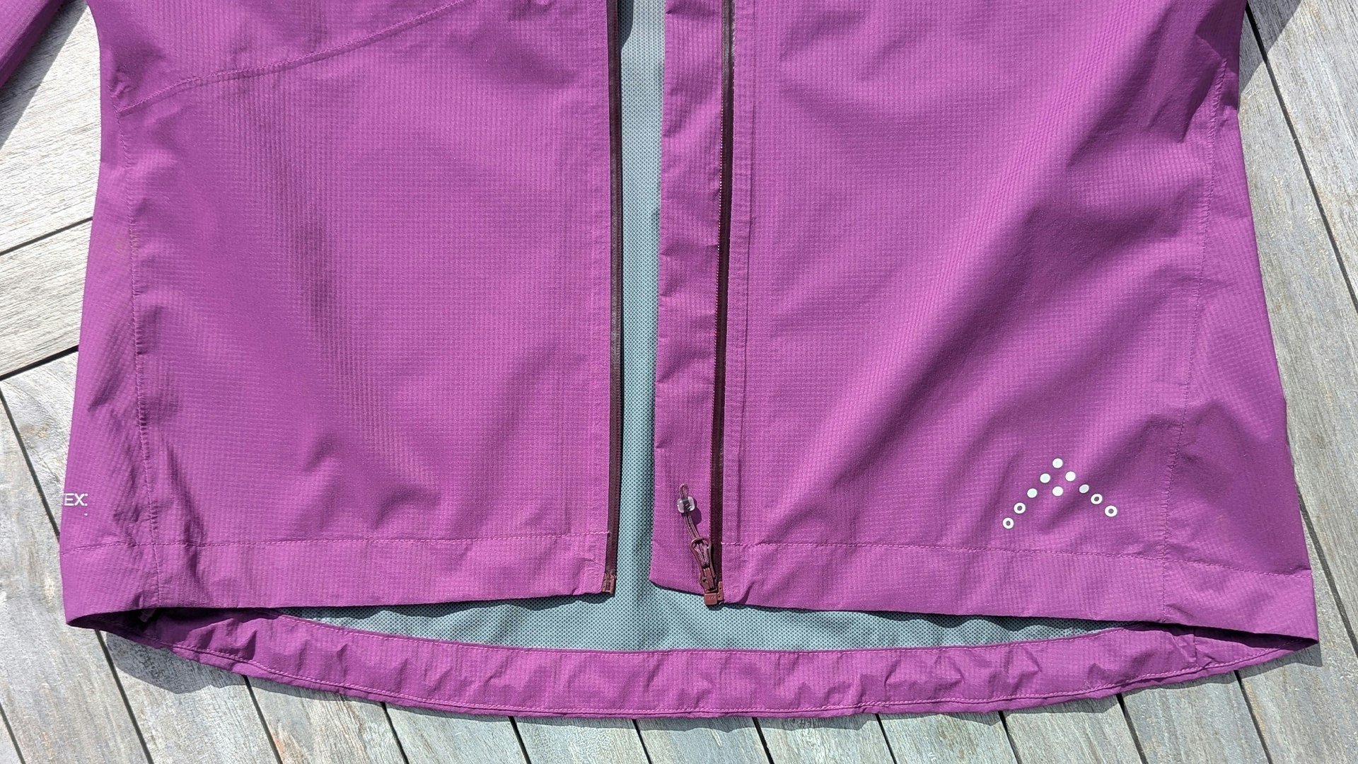 Hem of Rab Downpour Trail Light waterproof running jacket