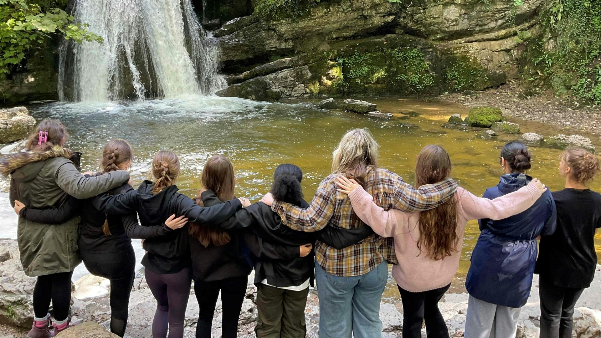 Kids enjoying the outdoors arm in arm