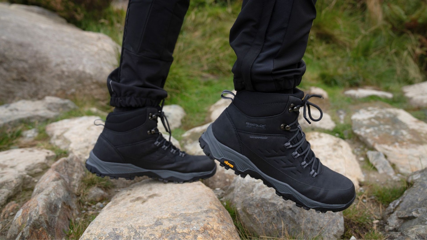 Person walking over rocks in the Regatta Blake boots