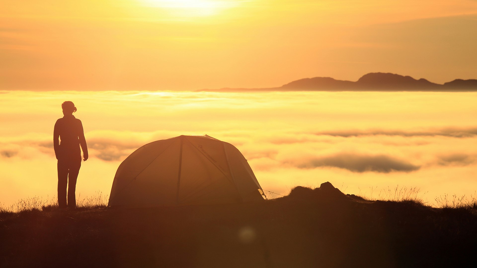 Above the clouds at sunset