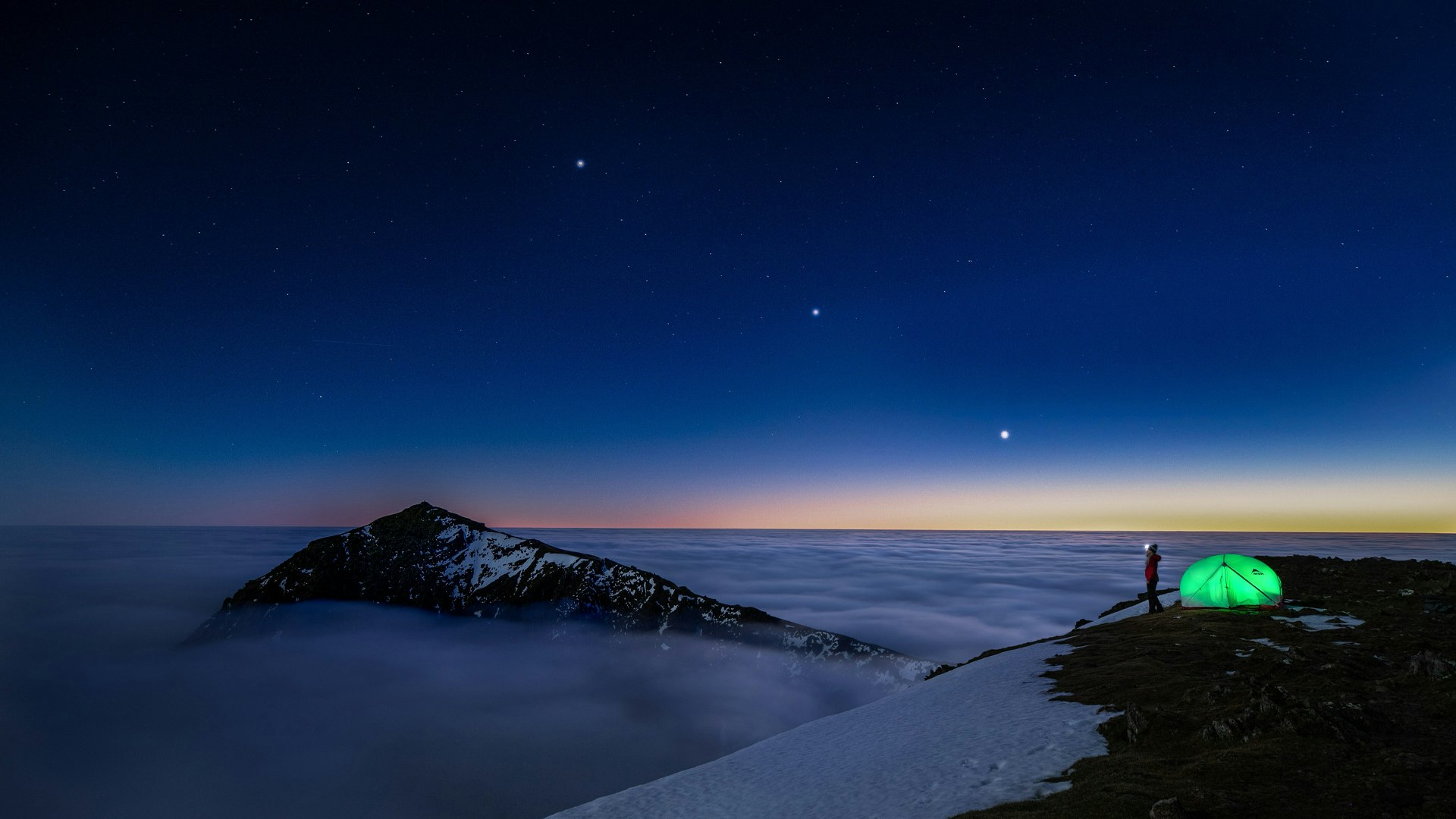 Night sky over snowy peaks