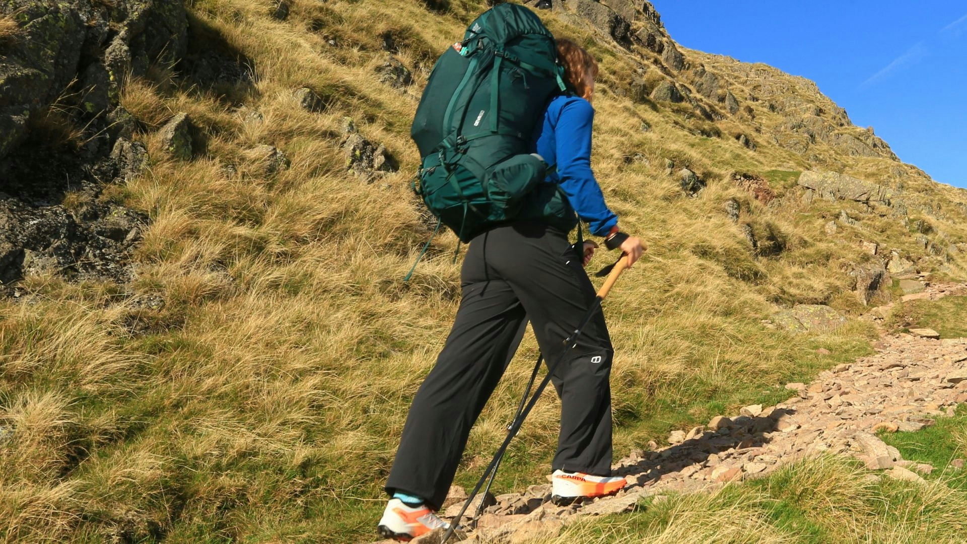Hiker wearing Berghaus Farren trousers and a big rucksack