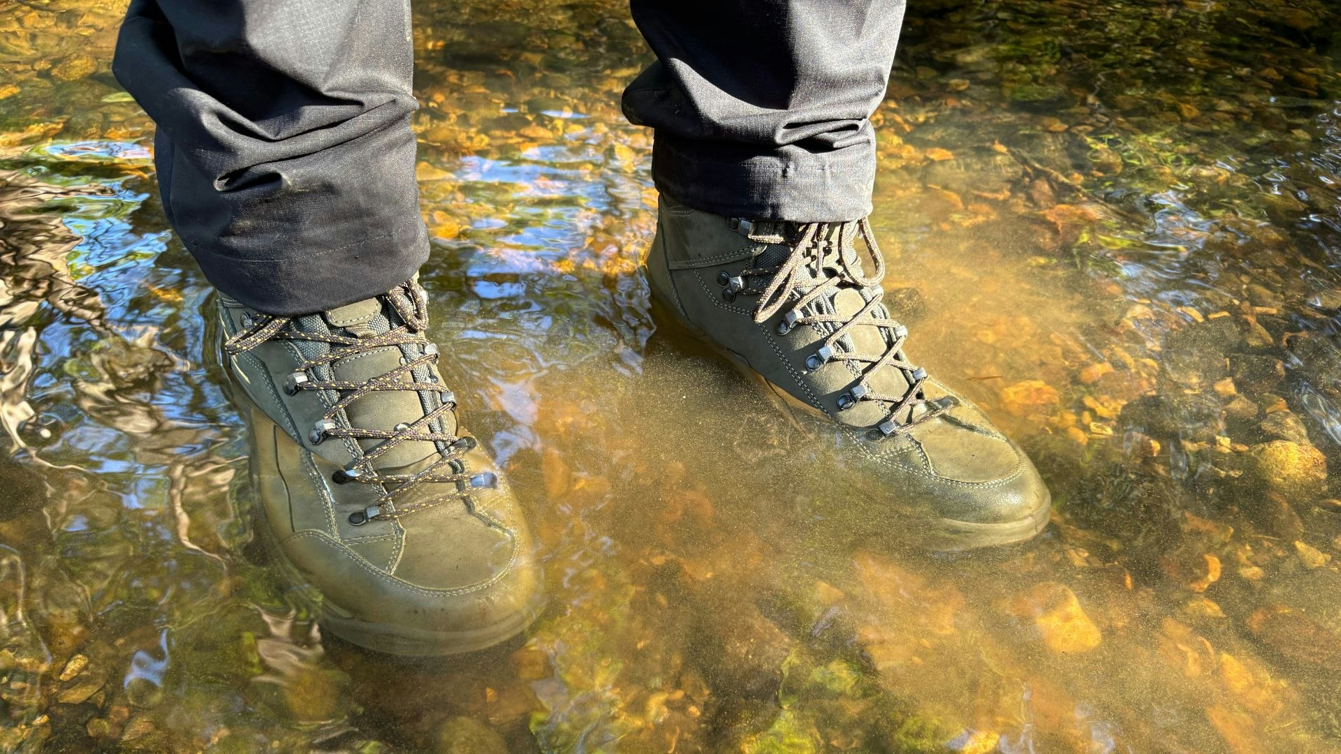 Man standing in water wearing Lowa Renegade Evo GTX boots