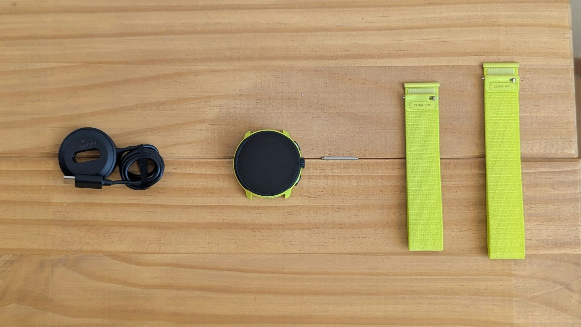 Suunto Run watch in pieces on a table