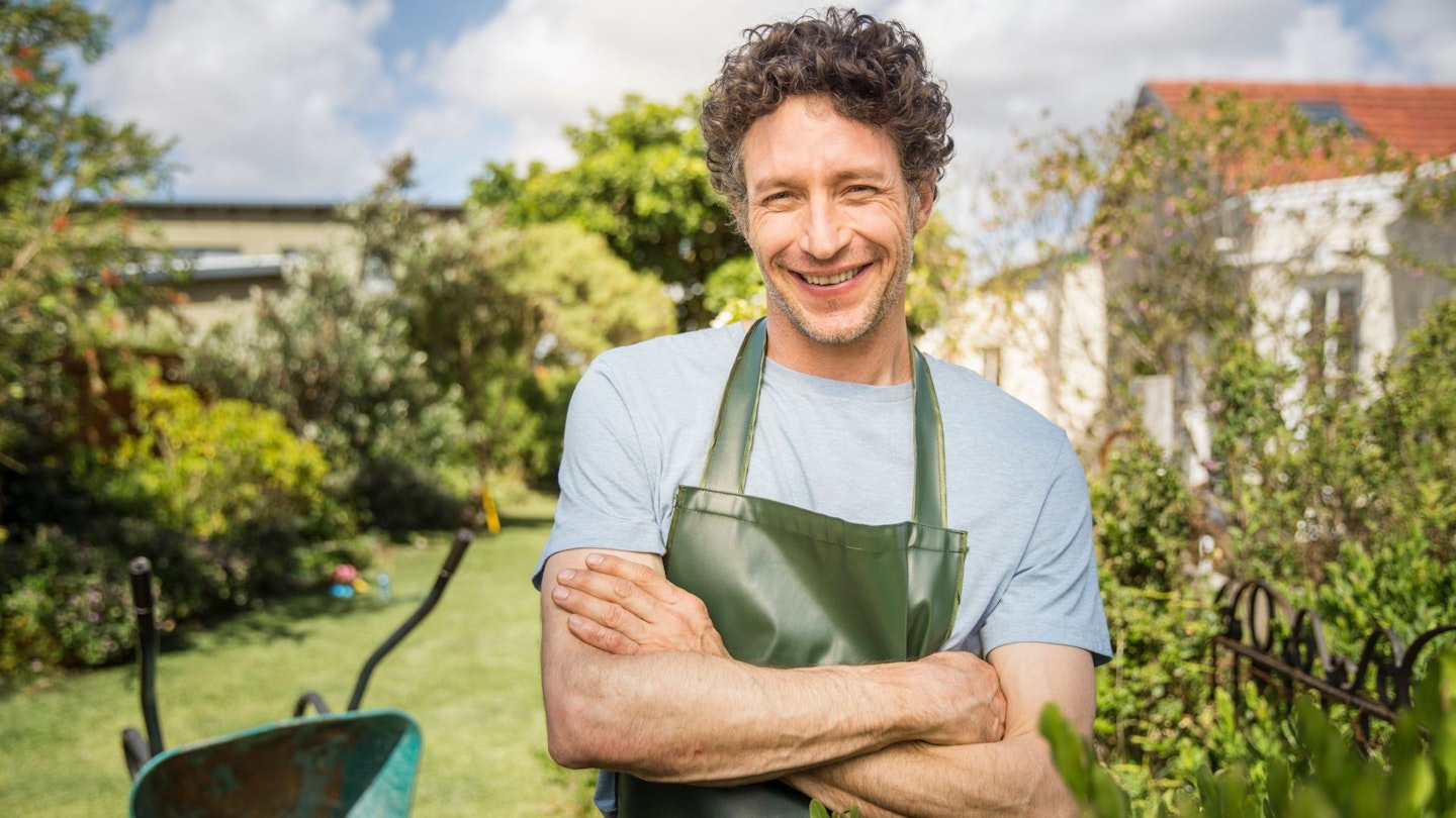 Man wearing a gardening apron