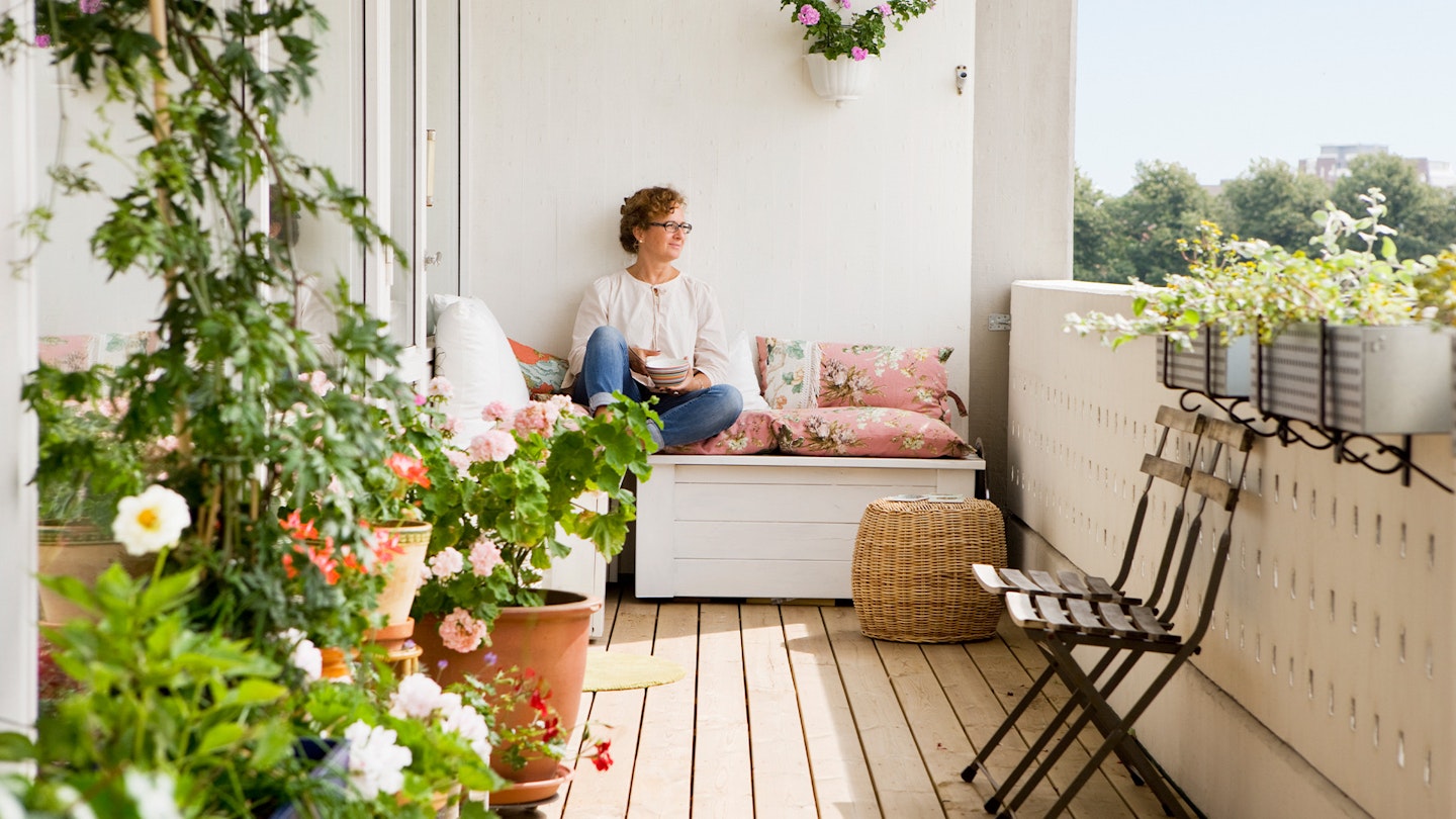 Woman relaxing on balcony