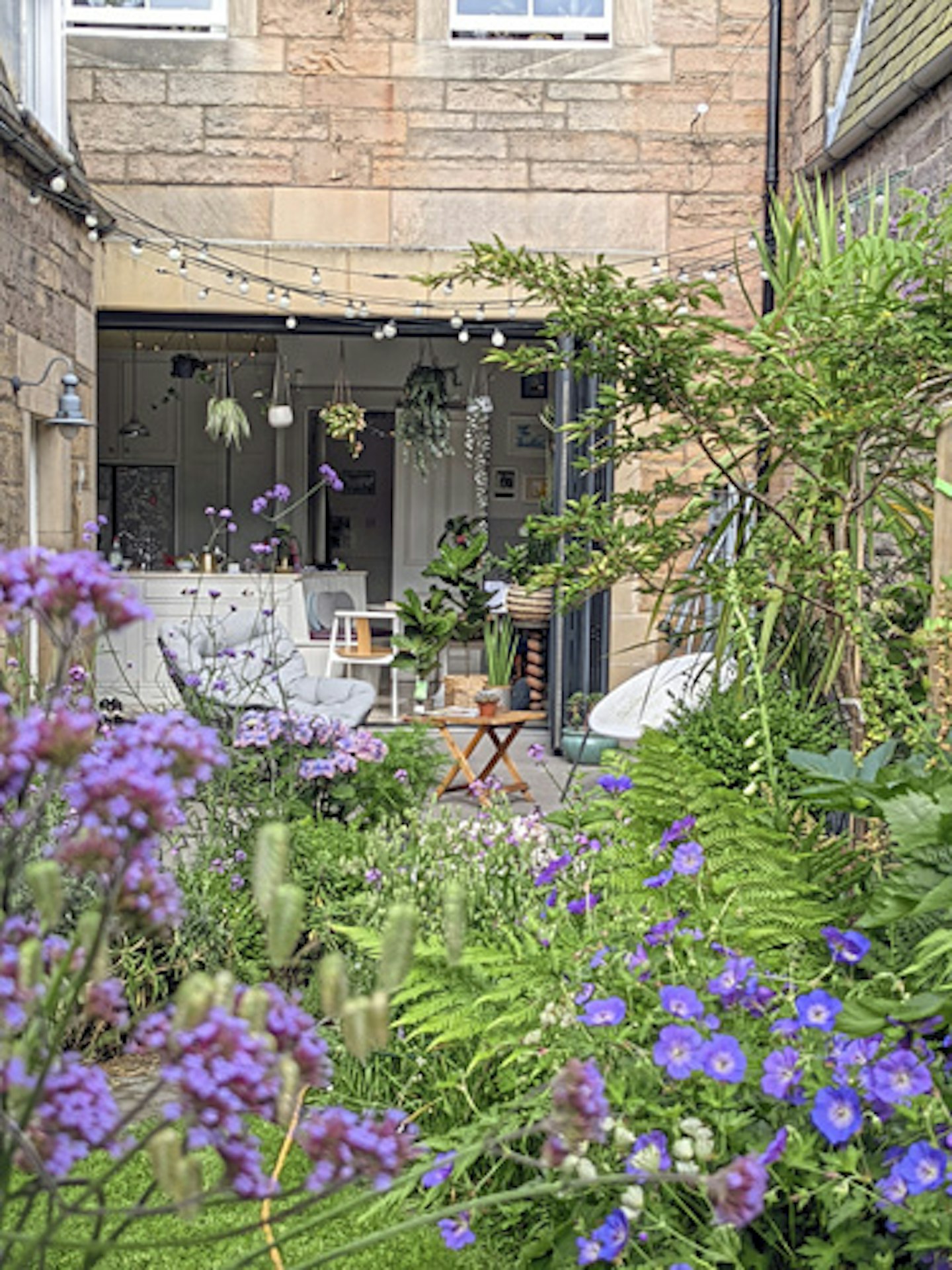 Looking back at the house with bifold doors open