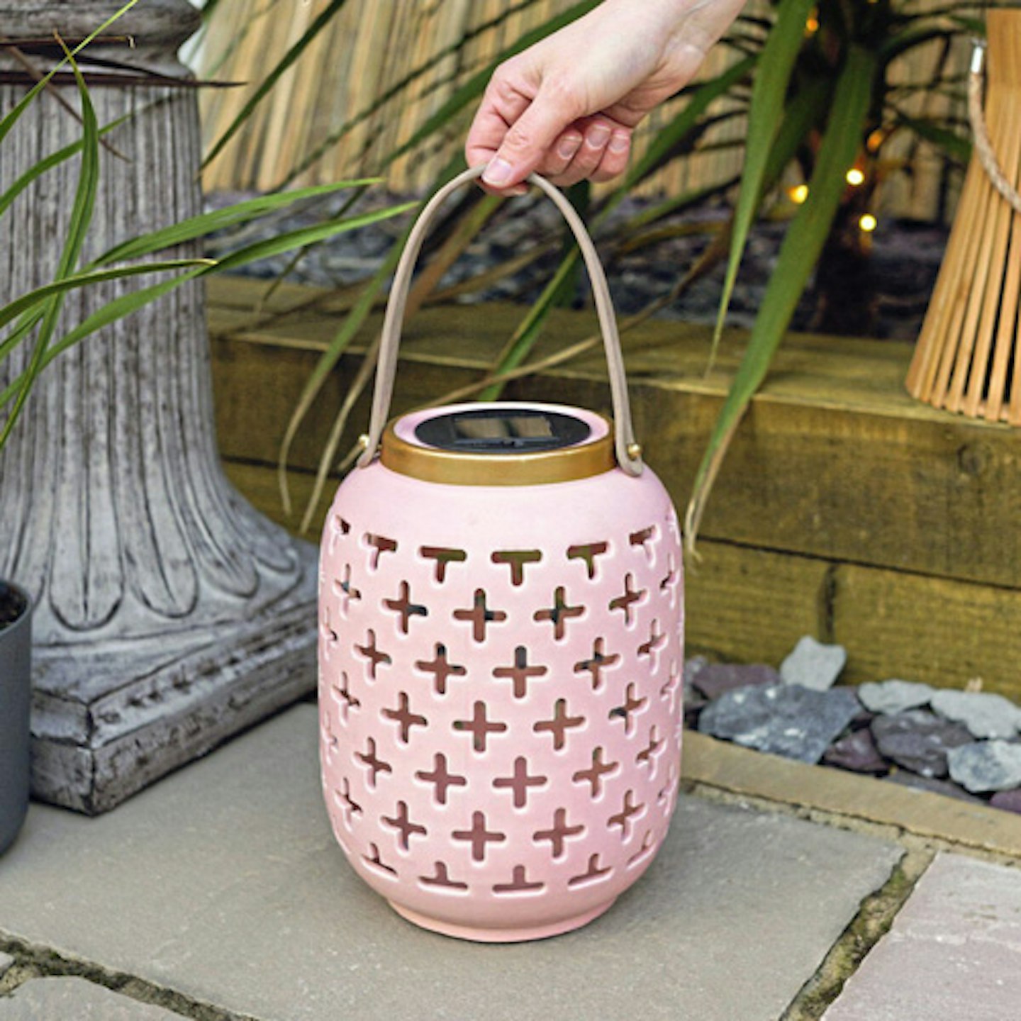 solar pink lantern being placed on patio