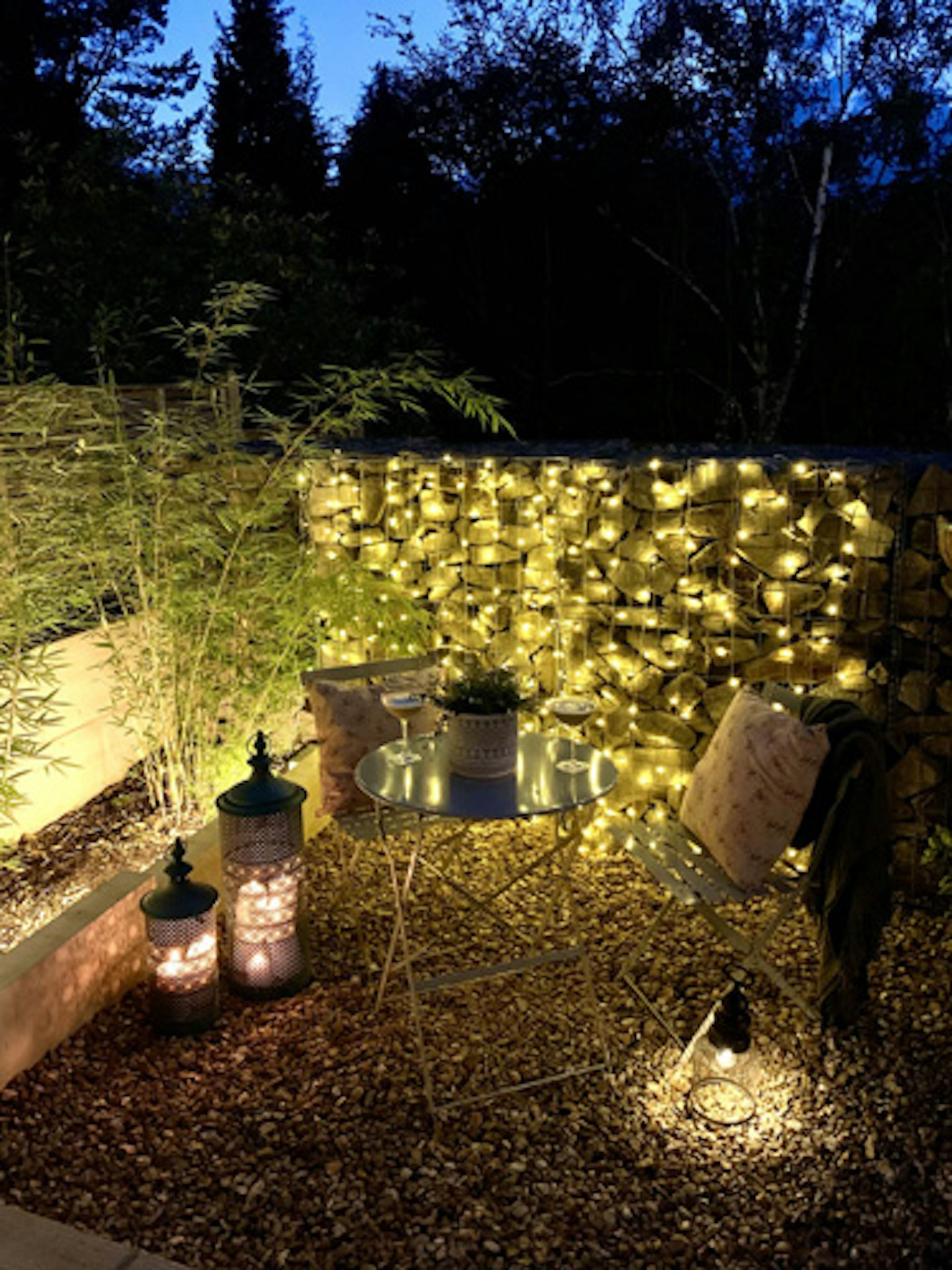 garden log store with fairylights