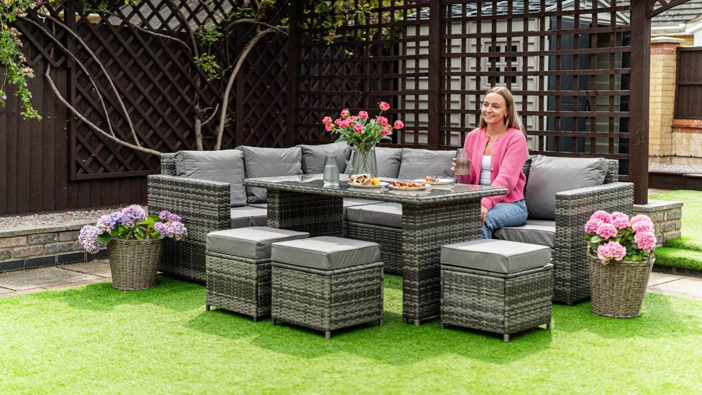 Woman sitting on new garden furniture set from Amazon