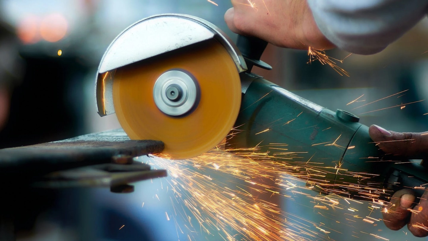 Angle grinder being used
