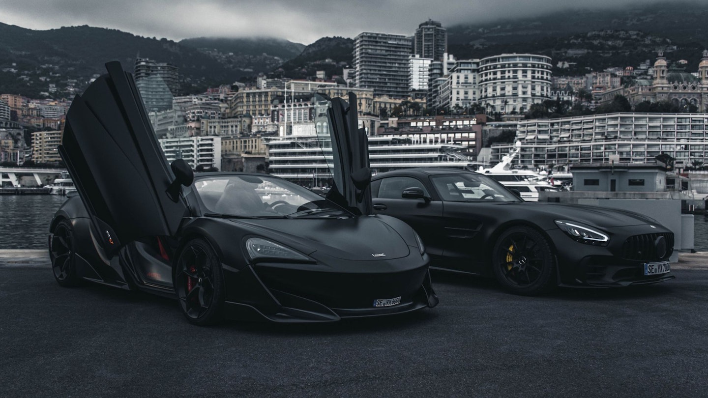 Two black matte supercars