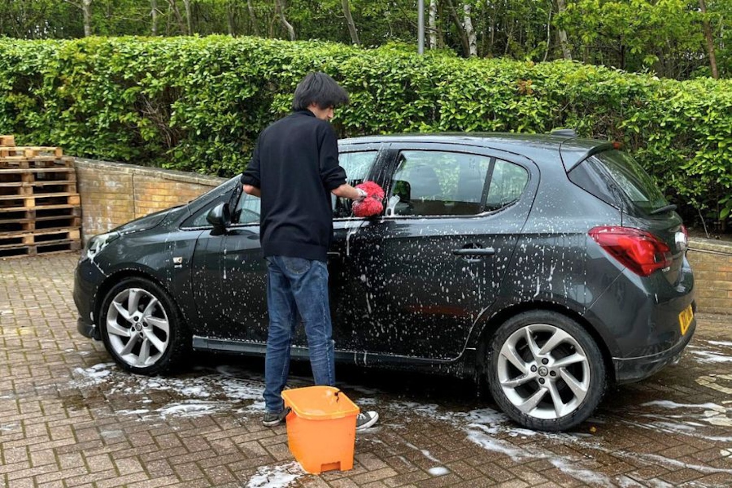 Aaron Hussain applying Autoglym's wash and wax shampoo