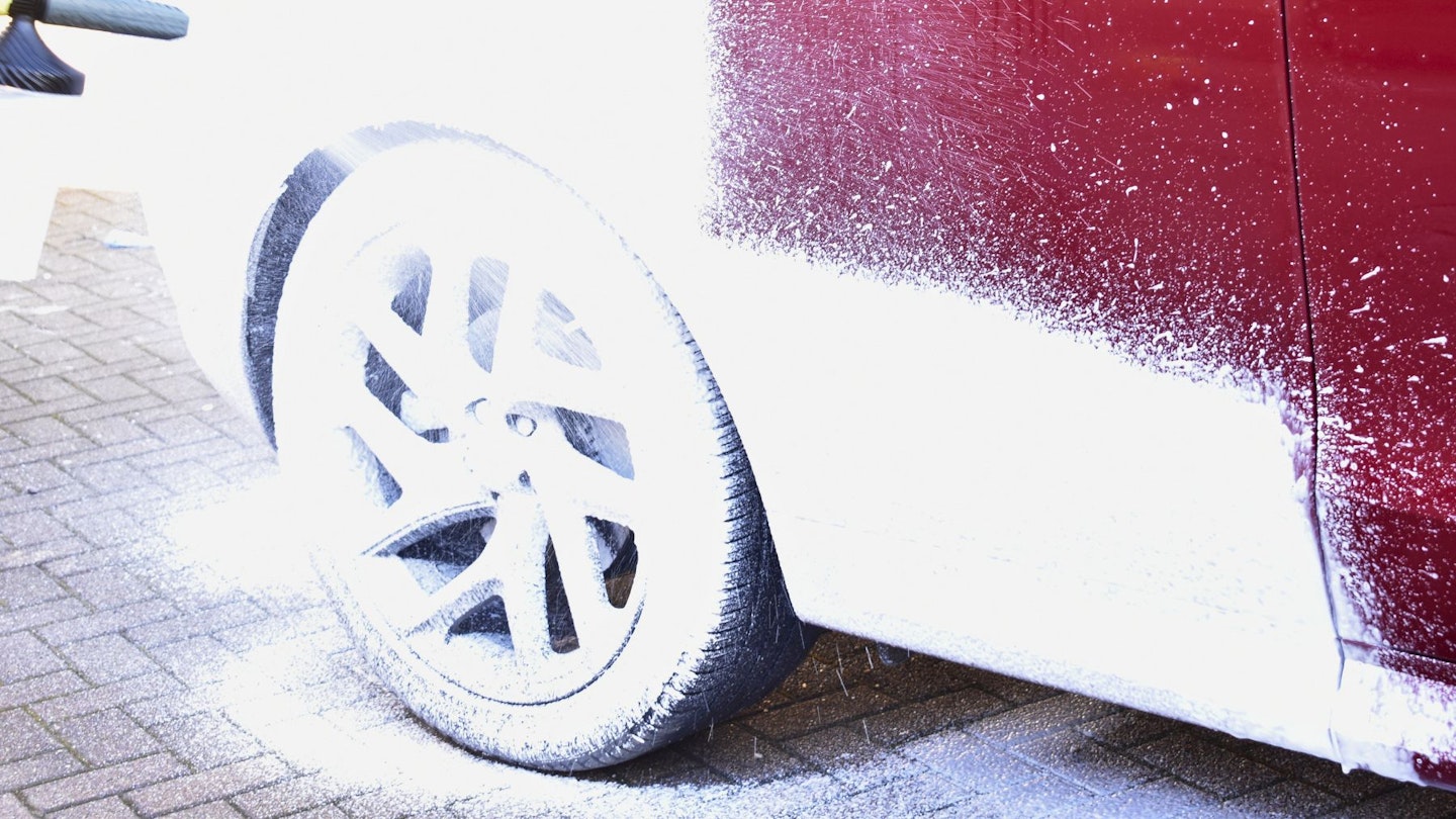 Applying snow foam to a car