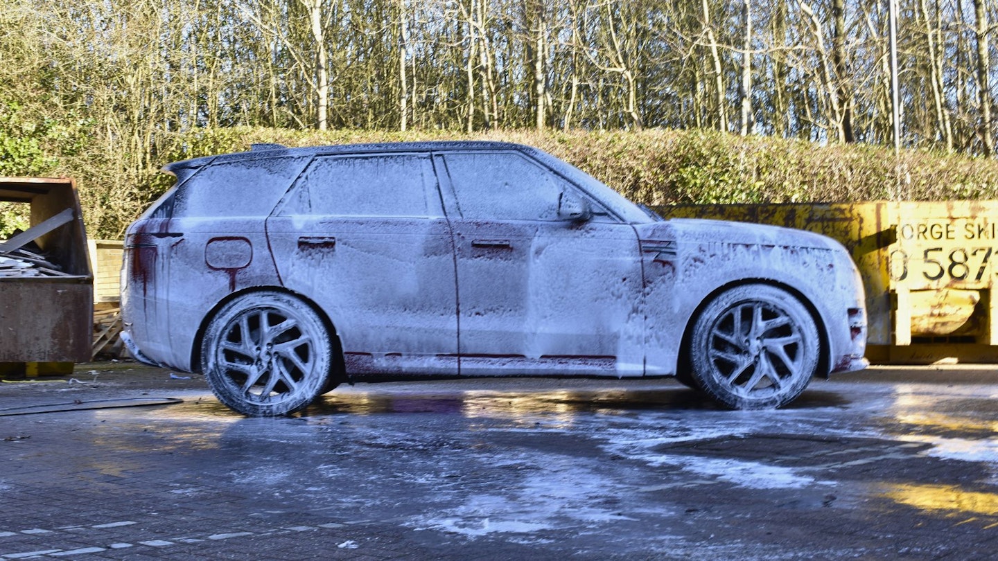 Range Rover sport covered in snow foam