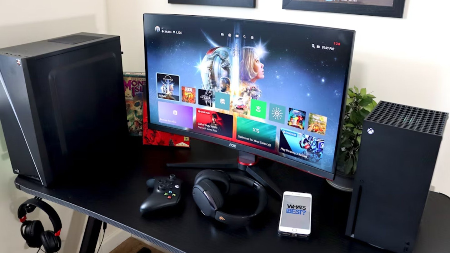 AOC Gaming CQ27G2SE monitor on a desk with an Xbox