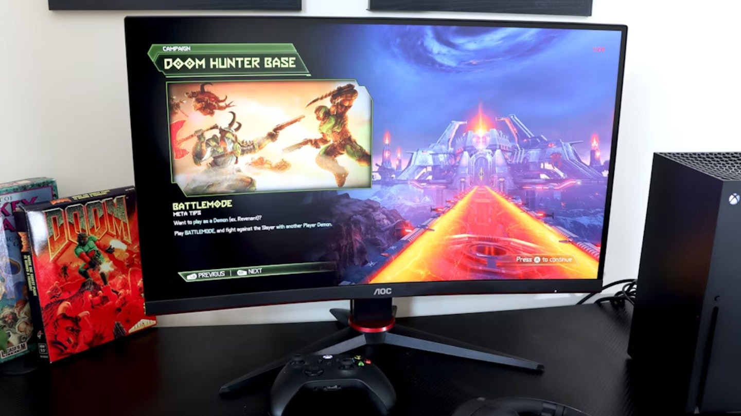 AOC Gaming CQ27G2SE monitor on a desk with an Xbox