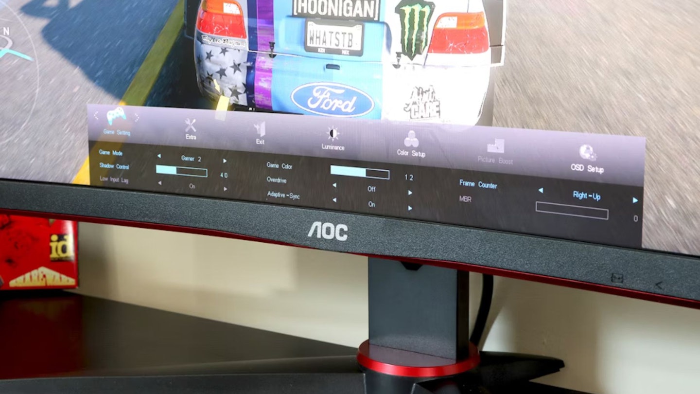 AOC Gaming CQ27G2SE monitor on a desk with an Xbox