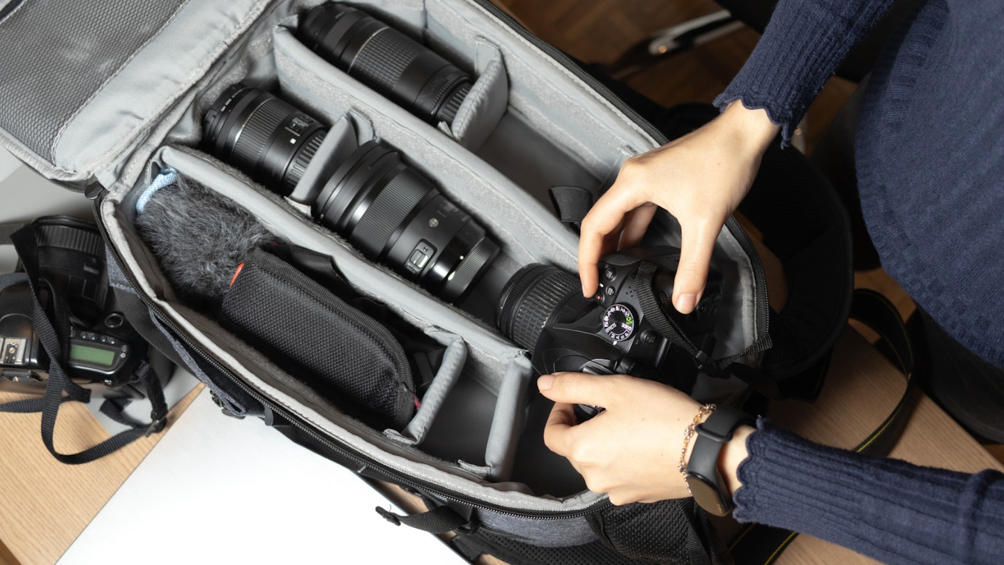 someone puts a lens into possibly the best camera bag