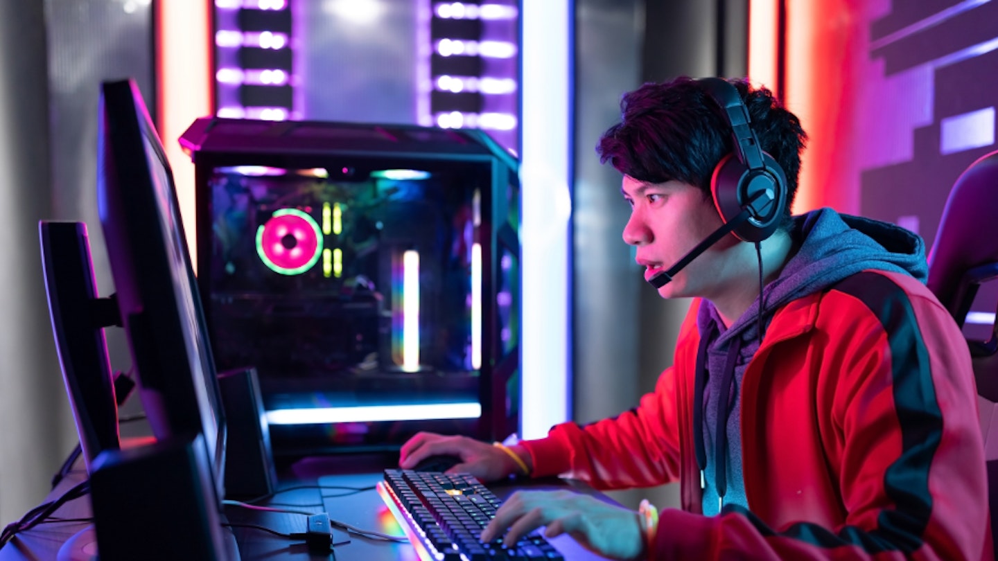 A person playing on a gaming PC