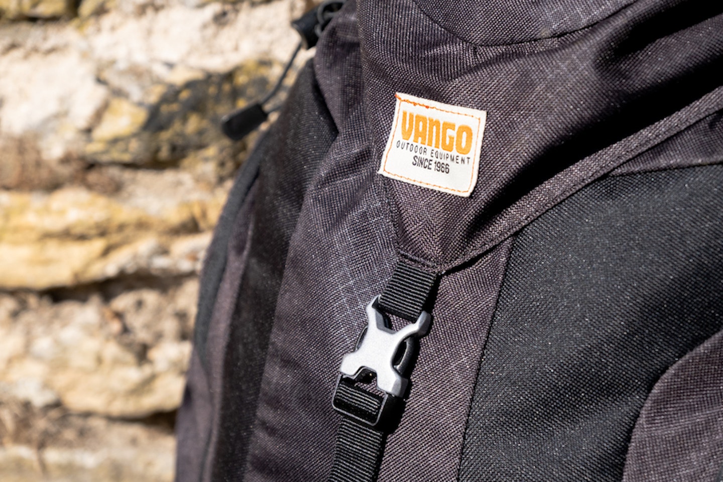 Vango Trail 35 logo and buckle close-up - note the grid pattern material