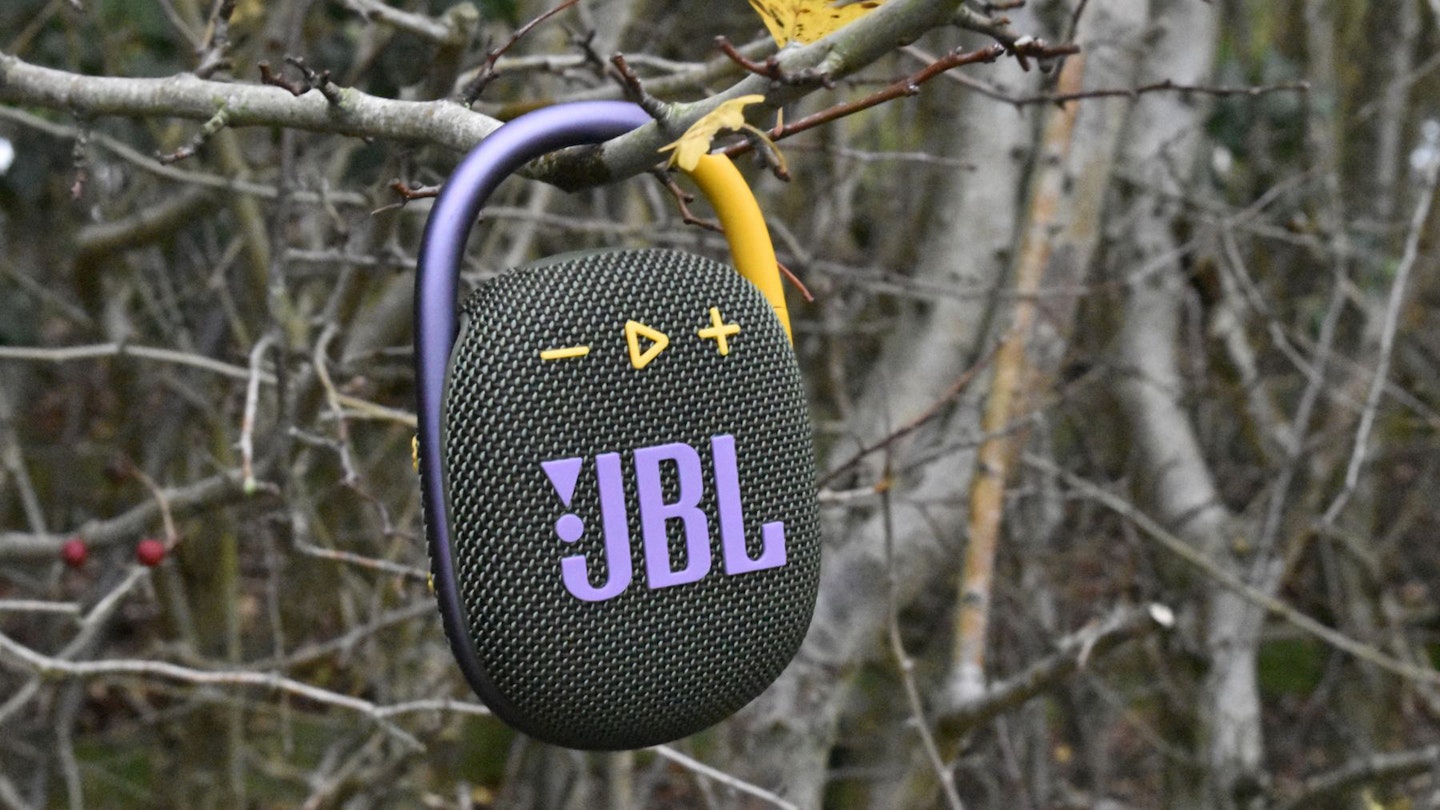 The JBL Clip 4 hanging from a tree