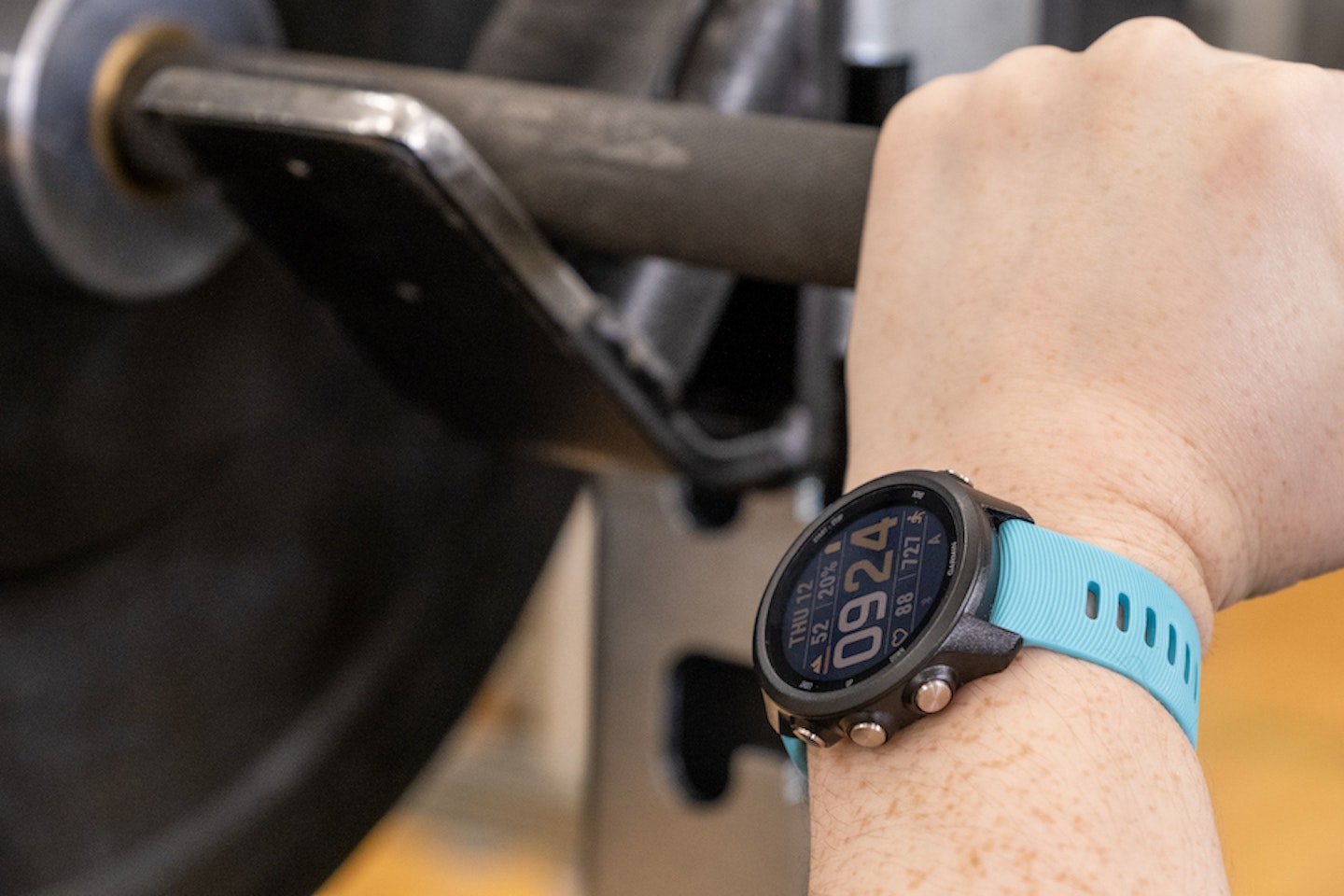 Garmin Forerunner 245 being used with a barbell