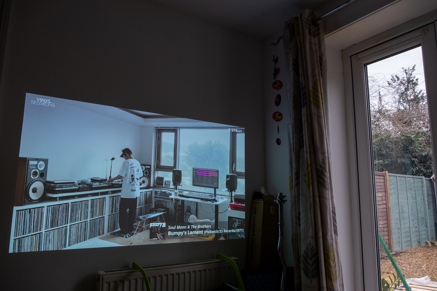 XGIMI HORIZON Pro 4K Projector playing a YouTube video in daylight