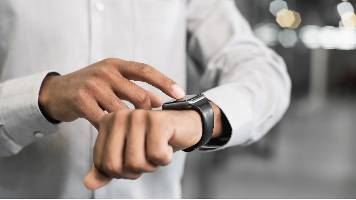 A person using a smartwatch for android
