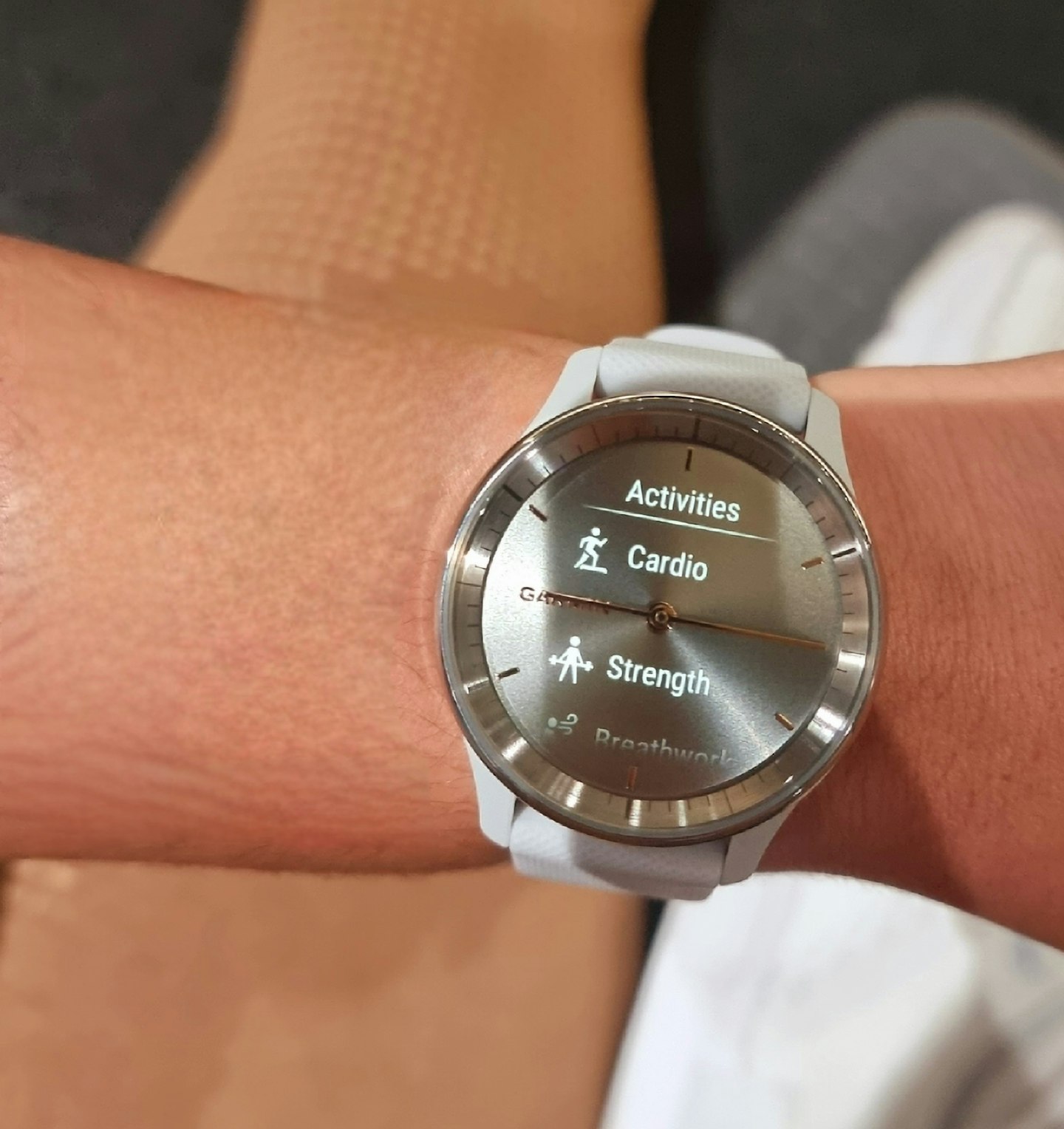 Close up of exercise options on Garmin vivomove trend watch