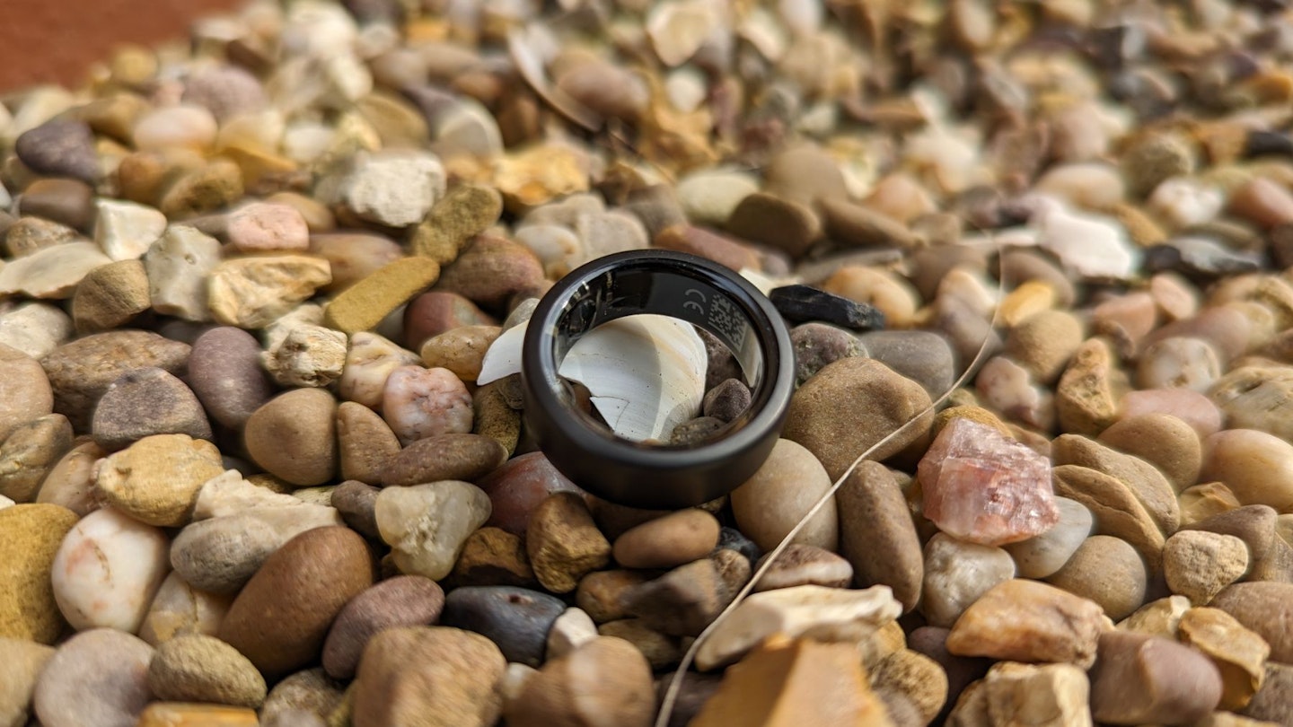 Oura Ring lying on gravel - best smart ring