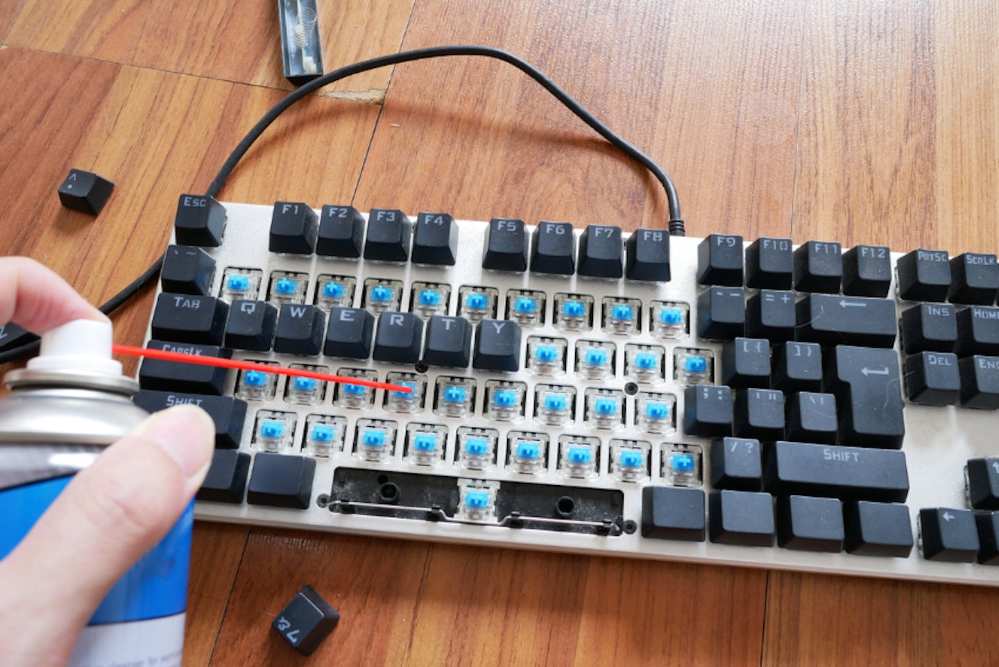 MECHANICAL KEYBOARD BEING CLEANED