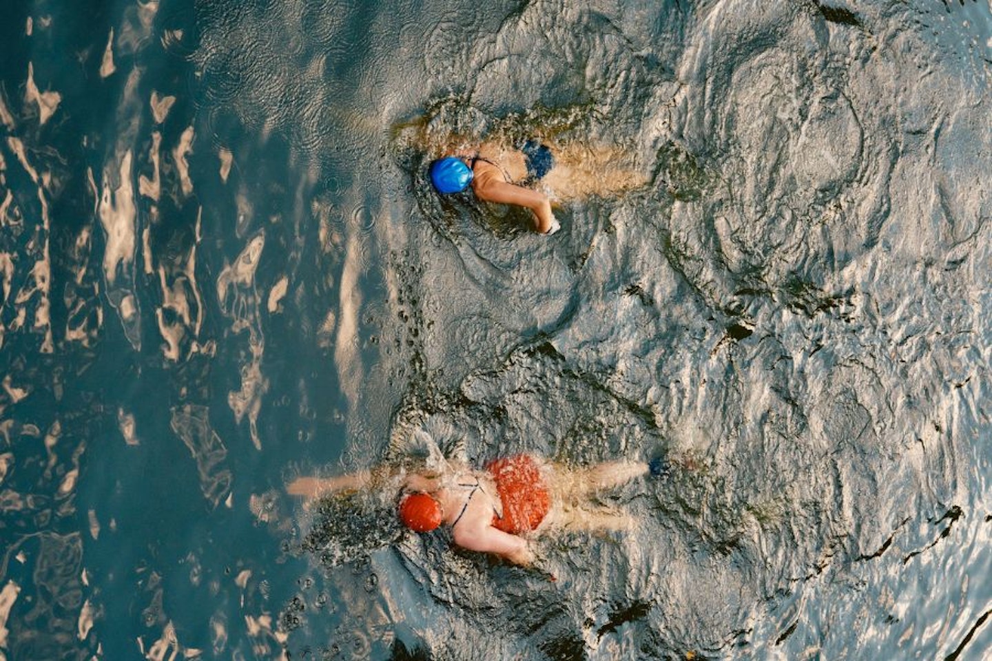 Two people open water swimming