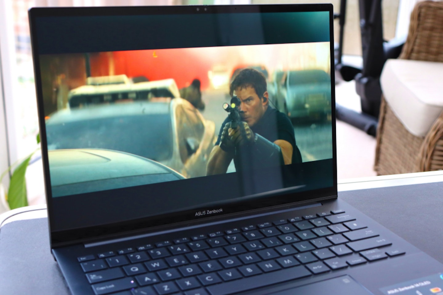 ASUS Zenbook 14 OLED laptop PLAYING A MOVIE