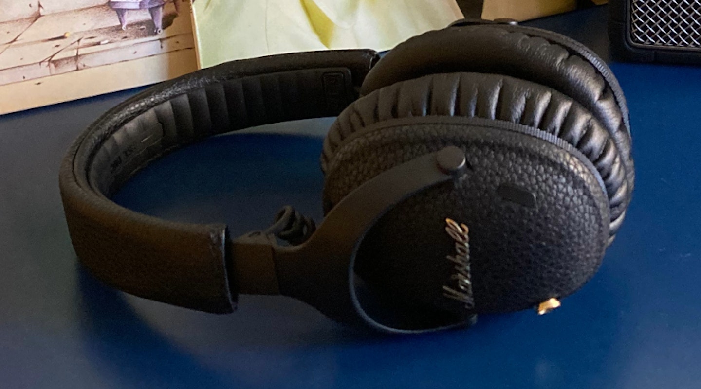 Marshall Monitor III ANC headphones, on unit in front of records