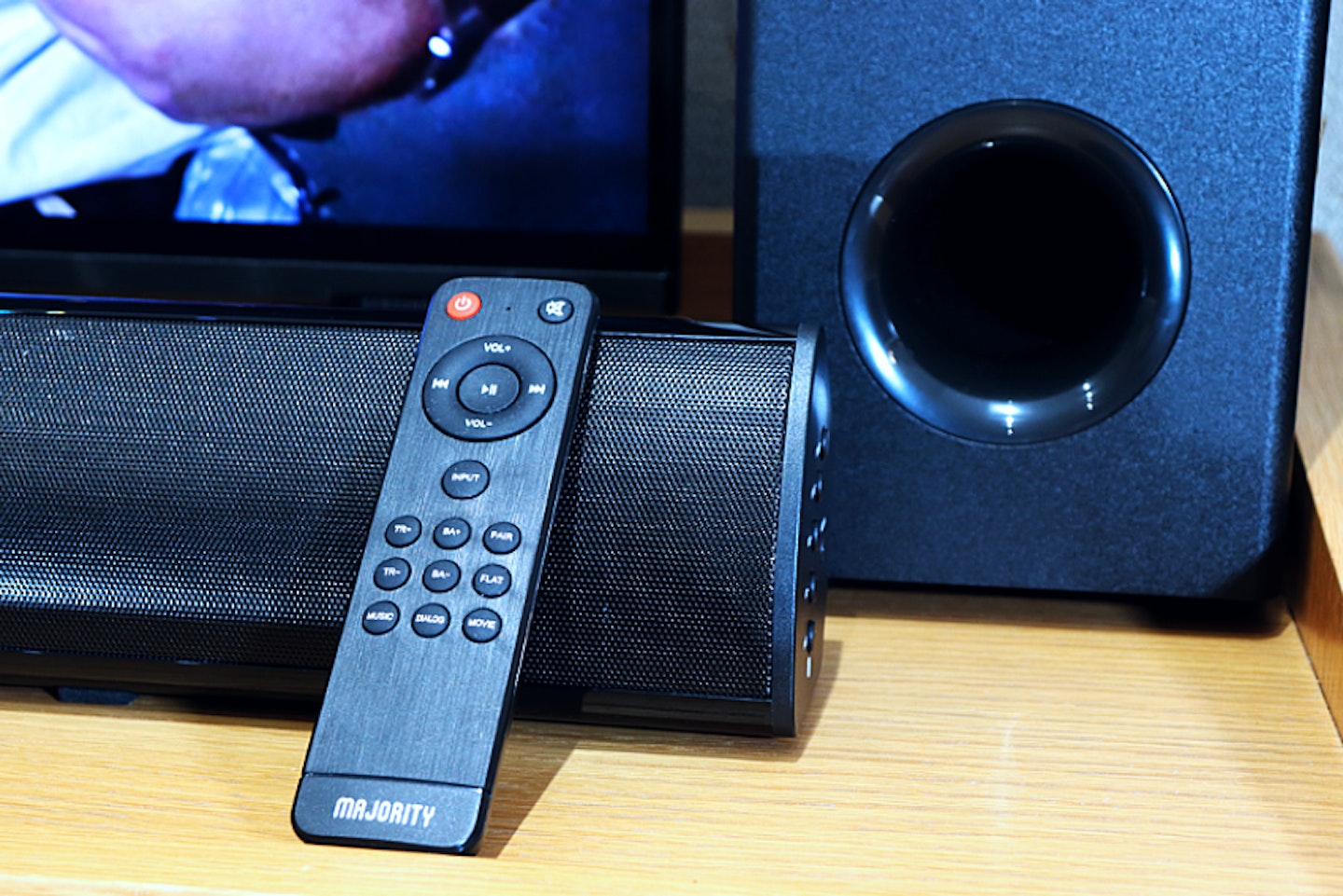 A TV SOUNDBAR SUBWOOFER AND REMOTE