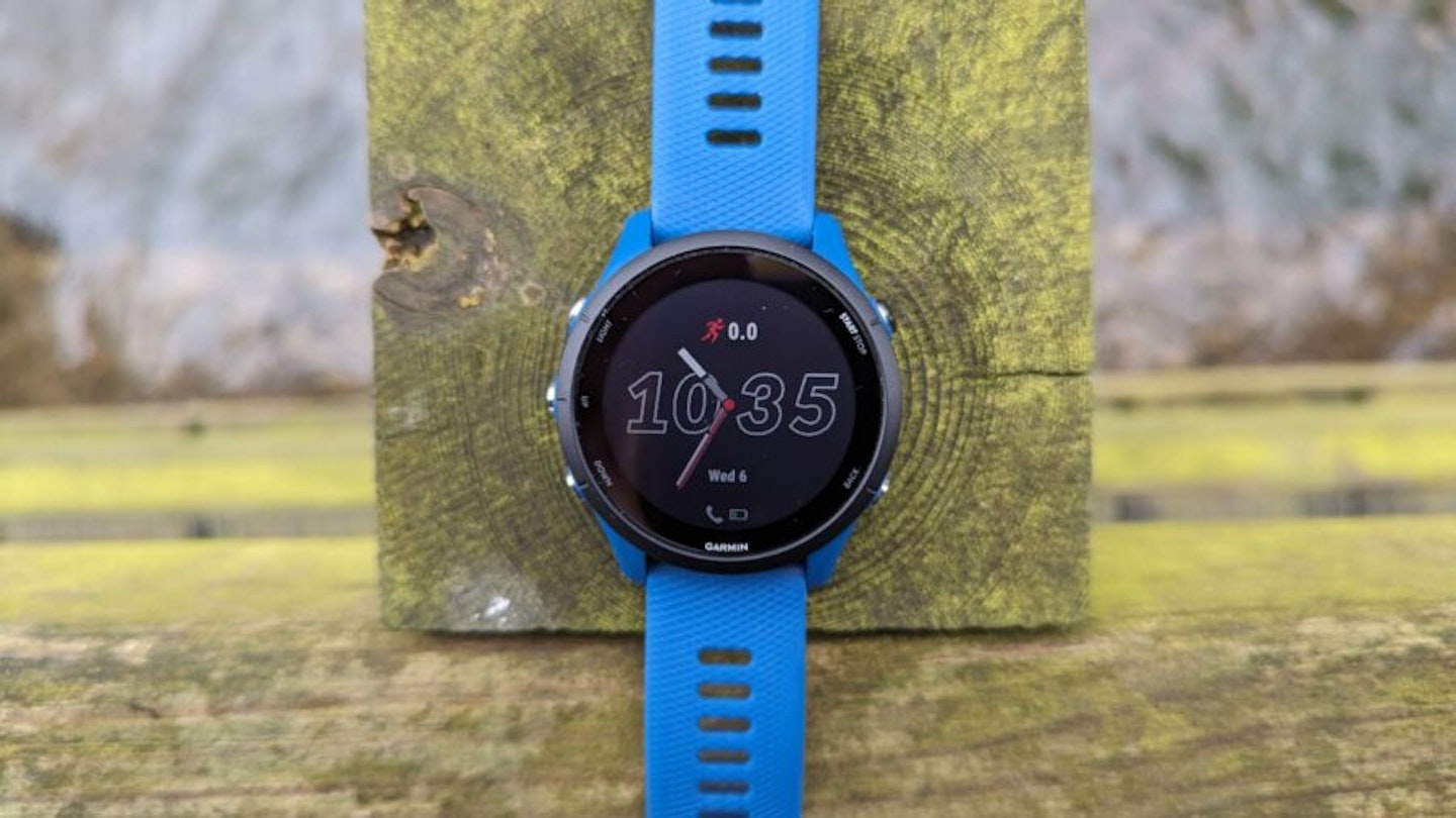 Garmin Forerunner 255 review - watch on a wooden post over a stream