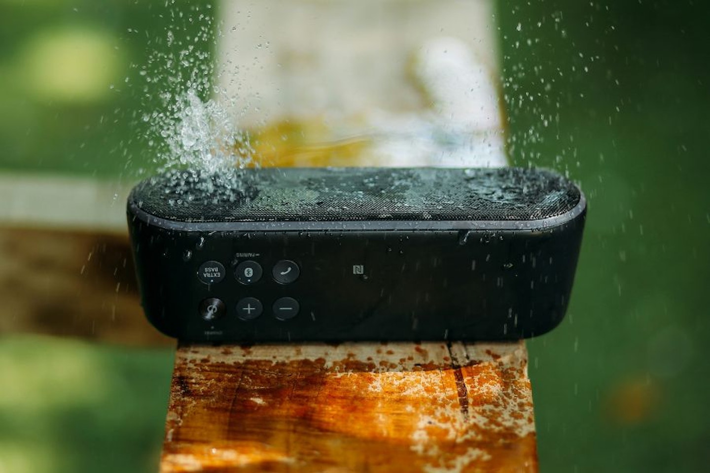 Budget-friendly Bluetooth speaker for students being splashed with water