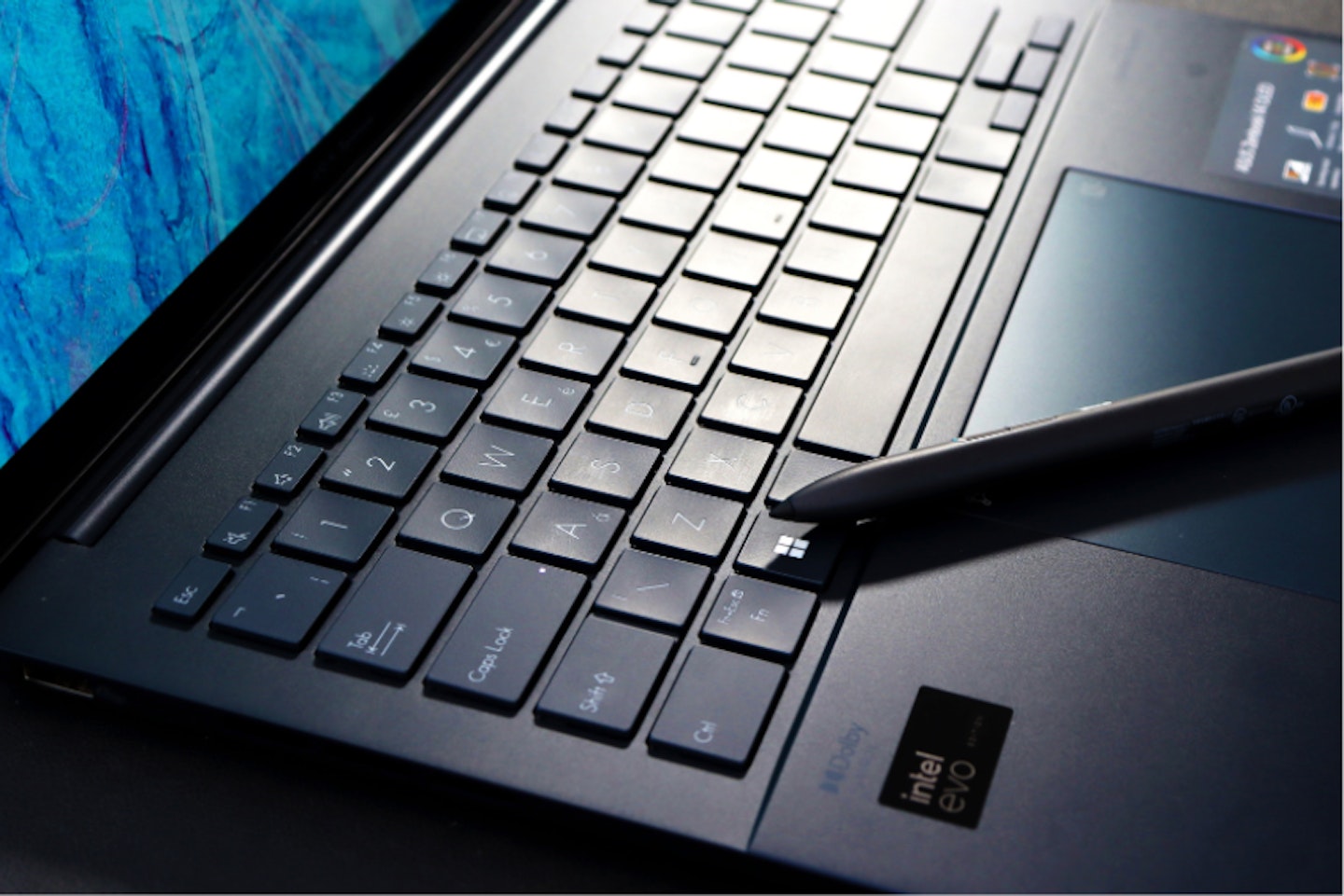 A laptop with a stylus pen
