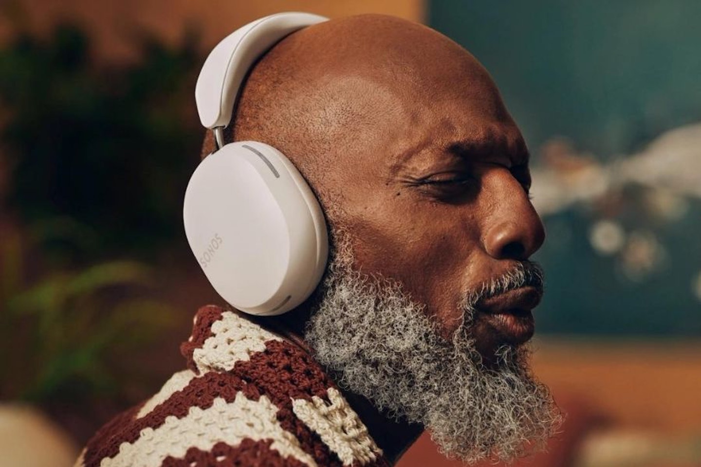 A man listening to music with Sonos' new Ace Headphones