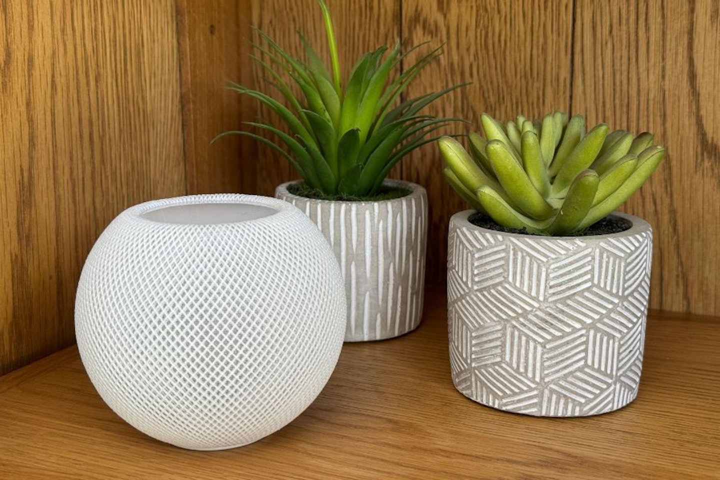 Apple HomePod mini on bookshelf