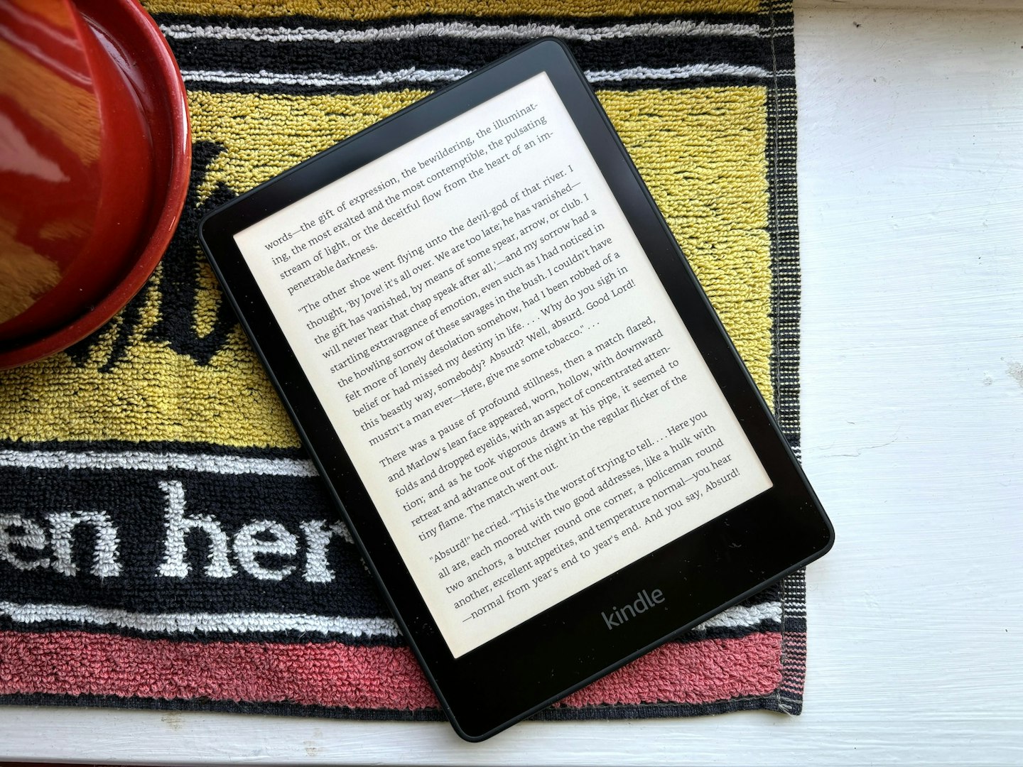 Kindle Paperwhite with a book loaded and ready to read, with page warmth turned down.