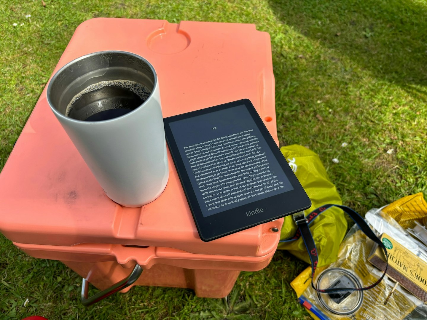 Kindle Paperwhite Dark Mode being used on camping trip