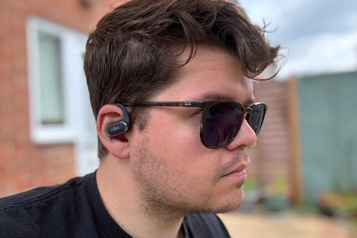 Shokz OpenFit Air being worn by reviewer
