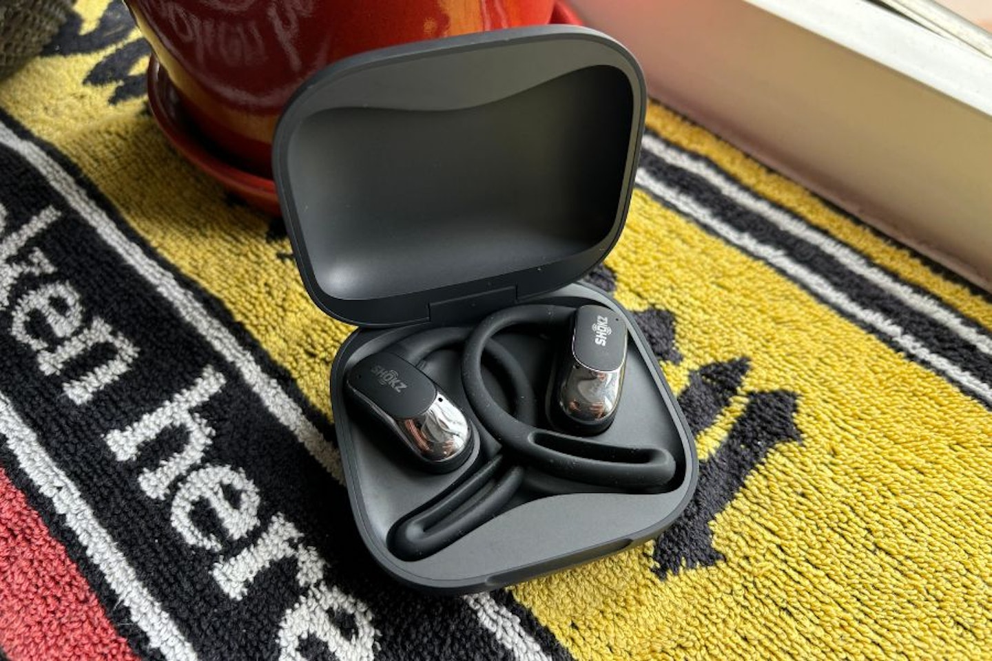 Shokz OpenFit Air in charging case