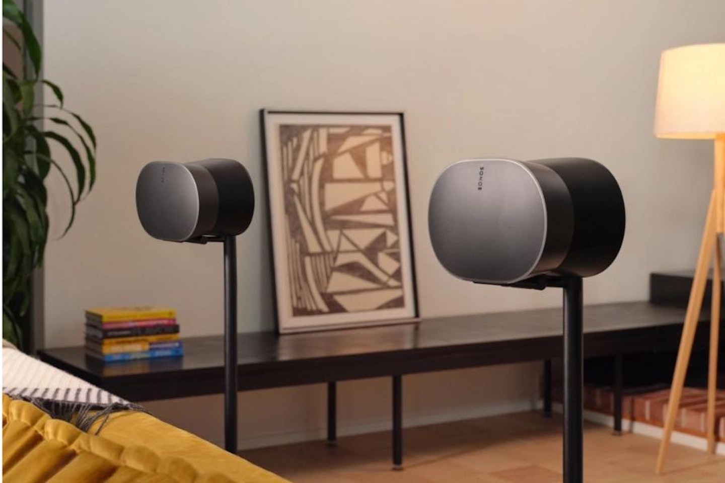 Two Sonos Era 300s on floor stands in a living space