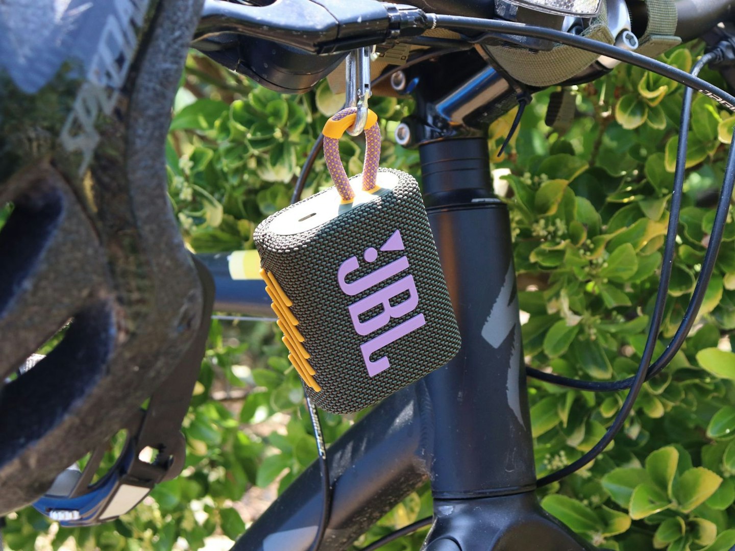 JBL Go 3 Bluetooth speaker on a bike handlebar