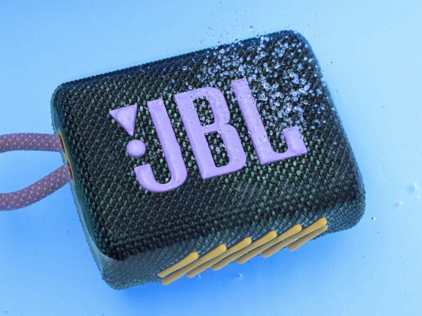 JBL Go 3 Bluetooth speaker in a pool of water