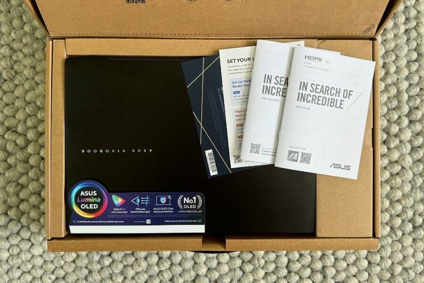 ASUS Vivobook S 14 OLED out of the box with accompanying documents